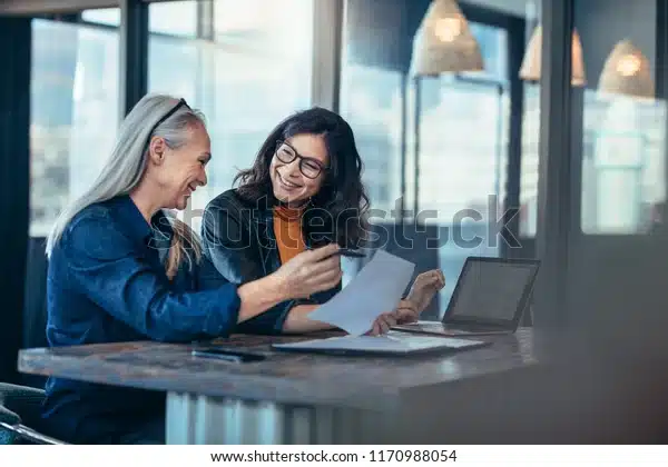 smiling-business-woman-working-together-600w-1170988054